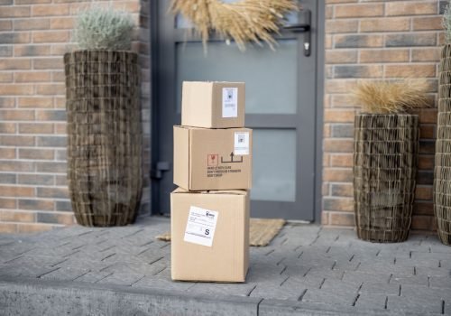 Parcels on the porch in front of the front door. Concept of contactless delivery goods home during a pandemic